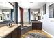A Primary bathroom features double vanity sinks and a soaking tub at 15260 W Alexandria Way, Surprise, AZ 85379