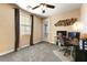 Bedroom with large window and a door to the patio at 15260 W Alexandria Way, Surprise, AZ 85379