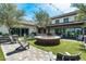 Outdoor community space with fire pit, surrounded by ample seating and manicured landscaping at 15260 W Alexandria Way, Surprise, AZ 85379