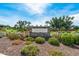 Attractive entrance sign for Homestead Park, featuring colorful landscaping and a clear blue sky at 15260 W Alexandria Way, Surprise, AZ 85379