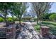 Inviting gazebo surrounded by lush trees and a well-maintained walking path at the community park at 15260 W Alexandria Way, Surprise, AZ 85379