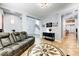 Spacious living room featuring an open floor plan and stylish furnishings at 15260 W Alexandria Way, Surprise, AZ 85379