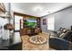 Comfortable entertainment room with large screen TV and stylish decor at 15260 W Alexandria Way, Surprise, AZ 85379