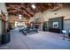 Expansive lounge area with vaulted ceilings, stone fireplace and comfortable seating at 15260 W Alexandria Way, Surprise, AZ 85379