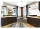 Elegant main bathroom with dual vanities, a soaking tub, and stylish fixtures at 15260 W Alexandria Way, Surprise, AZ 85379