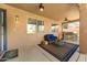 Covered patio with grill, outdoor seating, and ceiling fan at 15260 W Alexandria Way, Surprise, AZ 85379