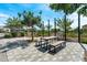 Community picnic area with barbecue grill, a dining table, and landscaped surroundings at 15260 W Alexandria Way, Surprise, AZ 85379