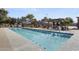 Inviting pool with ample lounge chairs and shaded pergola areas for relaxation at 15260 W Alexandria Way, Surprise, AZ 85379