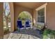 Cozy front porch with comfortable seating and stylish decor at 15260 W Alexandria Way, Surprise, AZ 85379