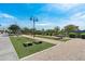 Community recreation area features artificial turf, horseshoe pits, and outdoor fitness equipment at 15260 W Alexandria Way, Surprise, AZ 85379