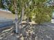 Backyard with hot tub and gravel landscaping surrounded by mature trees at 15720 S Lanai Cir, Arizona City, AZ 85123