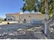 Backyard with gravel landscaping, patio, comfortable seating and hot tub at 15720 S Lanai Cir, Arizona City, AZ 85123