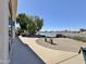 Lovely backyard patio with comfortable seating overlooks scenic lake views and gravel landscaping at 15720 S Lanai Cir, Arizona City, AZ 85123