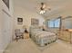 Inviting bedroom with a ceiling fan, a window and comfortable furnishings at 15720 S Lanai Cir, Arizona City, AZ 85123