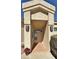 Inviting front entry with a tiled walkway, sconces, and a covered porch at 15720 S Lanai Cir, Arizona City, AZ 85123