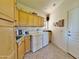 Bright laundry room with a sink, abundant storage, and a washer and dryer set at 15720 S Lanai Cir, Arizona City, AZ 85123