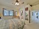 Comfortable bedroom has a window for natural light and access to the Primary bath at 15720 S Lanai Cir, Arizona City, AZ 85123