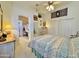 Relaxing bedroom with a fan, closet, dresser and access to the Primary bath at 15720 S Lanai Cir, Arizona City, AZ 85123