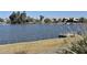 Scenic view of waterfront property with well maintained shoreline at 15720 S Lanai Cir, Arizona City, AZ 85123