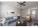 Bonus room with a corner sofa, armchair, chess set, and a small decorative plant at 16227 W Mariposa Grande --, Surprise, AZ 85387