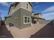 Two-story home featuring neutral stucco, concrete patio, and easy-to-maintain desert landscaping at 16227 W Mariposa Grande --, Surprise, AZ 85387