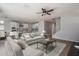 Staged kitchen with white cabinets, stainless steel appliances, and breakfast bar with seating at 16227 W Mariposa Grande --, Surprise, AZ 85387