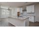 Bright kitchen with white cabinets, granite countertops, and a stainless steel hood at 16227 W Mariposa Grande --, Surprise, AZ 85387