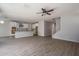 Open-concept kitchen with white cabinets, stainless steel appliances, and tile backsplash at 16227 W Mariposa Grande --, Surprise, AZ 85387