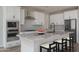 Bright kitchen features granite countertops, stainless appliances, and a central island with seating at 16227 W Mariposa Grande --, Surprise, AZ 85387