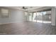 Spacious living room with tile flooring, recessed lighting, and sliding glass door to the backyard at 16227 W Mariposa Grande --, Surprise, AZ 85387