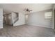 Unfurnished living room with tile flooring, recessed lighting, stair access, and neutral color palette at 16227 W Mariposa Grande --, Surprise, AZ 85387
