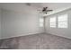 Bright bedroom with a ceiling fan and two windows letting in lots of natural light at 16227 W Mariposa Grande --, Surprise, AZ 85387