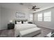 Cozy main bedroom featuring a bed, bedside tables, and a bench at the foot of the bed at 16227 W Mariposa Grande --, Surprise, AZ 85387