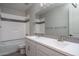 Stylish bathroom with a double sink vanity, large mirror, and tiled shower/tub combo at 16277 W Mariposa Grande --, Surprise, AZ 85387