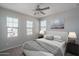 Cozy bedroom with neutral decor, carpet, ceiling fan, and lots of natural light at 16277 W Mariposa Grande --, Surprise, AZ 85387
