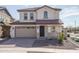 Charming two-story home with a tile roof, two-car garage, and a well-maintained front yard at 16277 W Mariposa Grande --, Surprise, AZ 85387