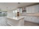 Spacious kitchen with white cabinets, a center island with a sink, and stainless steel appliances at 16277 W Mariposa Grande --, Surprise, AZ 85387