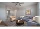 Comfortable living room with plush seating and a large window for natural light at 16277 W Mariposa Grande --, Surprise, AZ 85387
