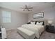 Bedroom with natural light, a ceiling fan, a large bed and a bench at 16277 W Mariposa Grande --, Surprise, AZ 85387