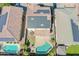 Drone shot featuring solar panels, and a backyard pool with patio at 16763 W Adams St, Goodyear, AZ 85338