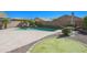 Lush backyard with sparkling pool, putting green, and patio area, perfect for outdoor enjoyment and entertainment at 16763 W Adams St, Goodyear, AZ 85338