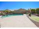 Backyard offers a swimming pool, mini golf, and mature plants at 16763 W Adams St, Goodyear, AZ 85338