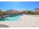 Backyard includes a swimming pool, putting green, and hammock at 16763 W Adams St, Goodyear, AZ 85338