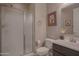 Bathroom featuring a glass-enclosed shower, vanity with sink, and tiled floor at 16763 W Adams St, Goodyear, AZ 85338
