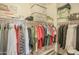 Walk-in closet with shelves and clothes racks, providing ample storage space at 16763 W Adams St, Goodyear, AZ 85338