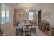 Formal dining room boasts a chandelier, wooden furniture, and neutral walls perfect for gatherings at 16763 W Adams St, Goodyear, AZ 85338