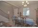 Inviting dining room with neutral walls, wood furniture, and natural light creates a cozy atmosphere at 16763 W Adams St, Goodyear, AZ 85338