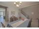 Open-concept dining room with hardwood floors, wooden furniture, and natural light from adjacent rooms at 16763 W Adams St, Goodyear, AZ 85338