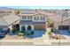 Beautiful two-story home boasting desert landscaping, a tile roof, and solar panels at 16763 W Adams St, Goodyear, AZ 85338