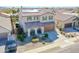 Beautiful two-story home with desert landscaping, solar panels, and a tile roof at 16763 W Adams St, Goodyear, AZ 85338